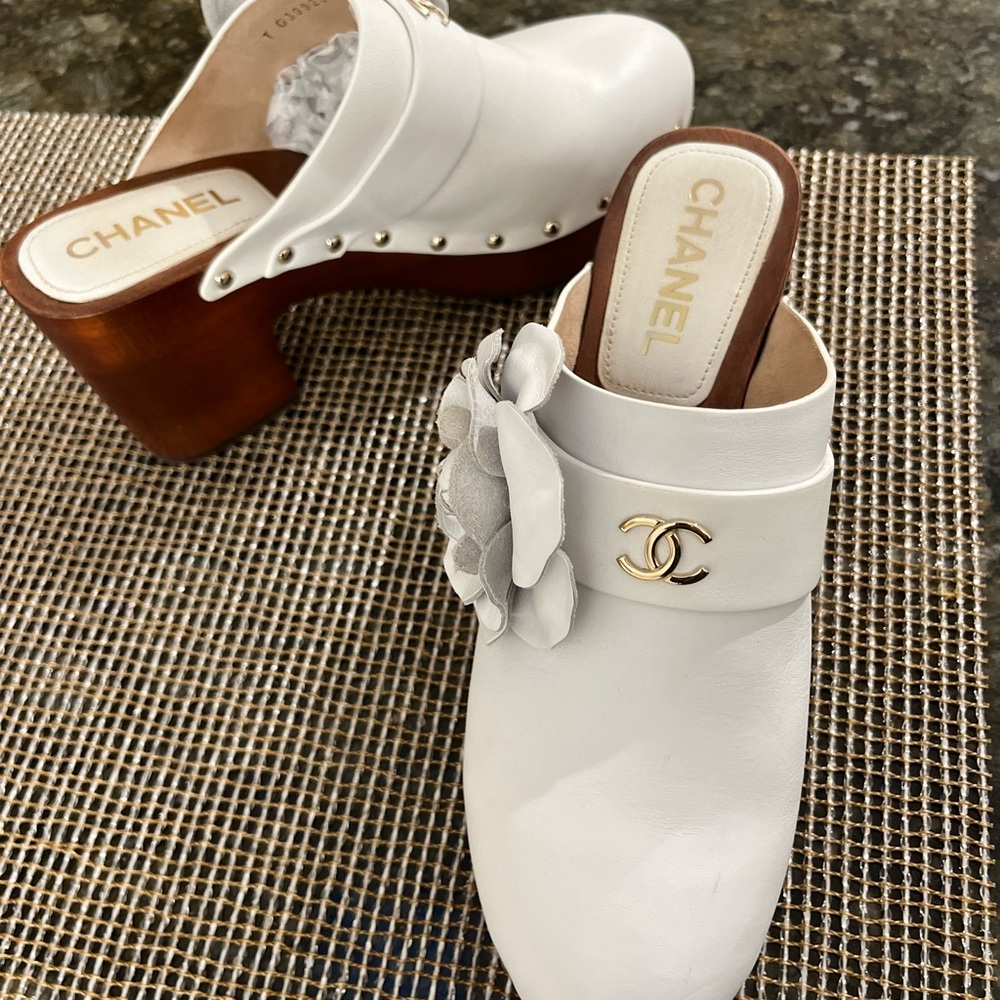 Chanel white clogs with flower . 3” heel gently worn